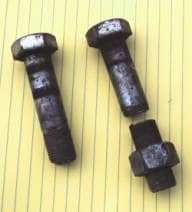 Photo of Portions of two of the bolts which were retrieved from the field where the planter broke down