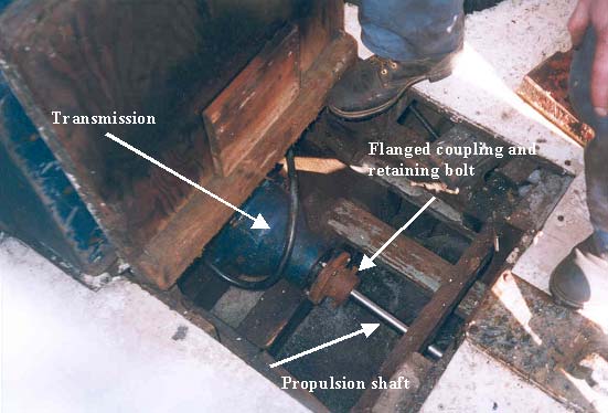 Open deck cover exposing a section of the transmission, flanged coupling and propulsion shaft. (Incident #2)