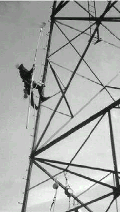 photo of tower worker climbing a tower