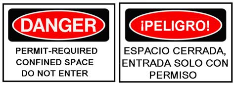 Warning signs printed in both English and Spanish