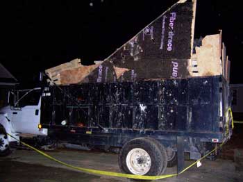 Trash truck. Scrap plywood pieces used to extend the truck bed height an additional 24 inches.