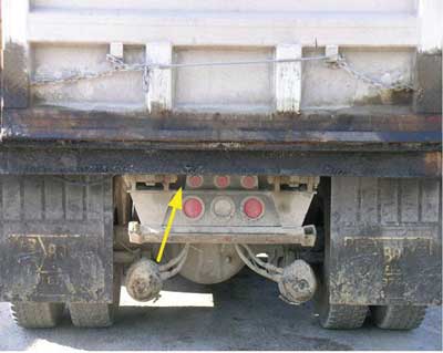 View of the rear of the truck.  The reverse signal alarm is mounted behind the frame.
