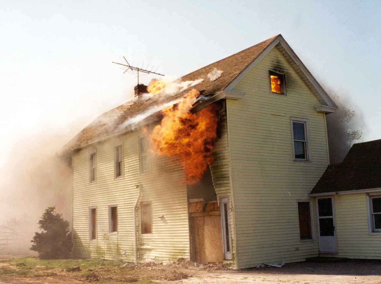 Front Page Photo: Photograph of the burning structure.