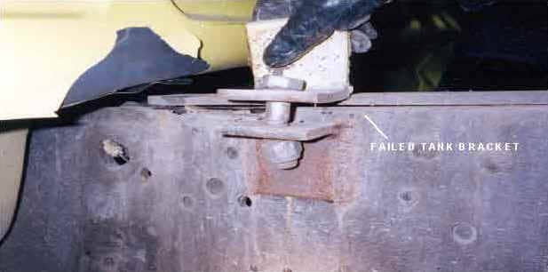 Photo 4. Driver's side front tank mount; tank bracket failed along fillet weld to tank frame
