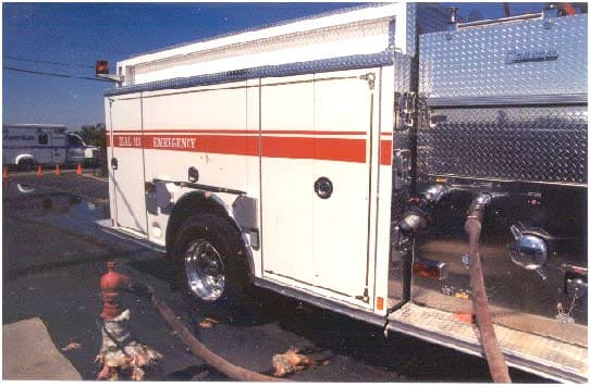 Photo 1. Engine's passenger side discharge panel; depicts fill line connected to #4 discharge and water holding tank's hydrant.
