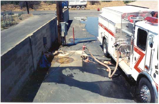 Photo 3. Original placement of water holding tank, hydrant, and plumbing system in relation to passenger side of engine.