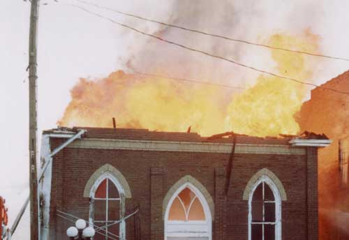 Photo 2. Church fire showing after collapse of roof and facade.