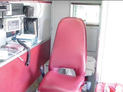Photo 2. Photo from similar ambulance illustrating the attendant's seat configuration prior to crash.
