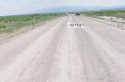 Photo 1. Incident Site, showing dirt road, indicating width.
