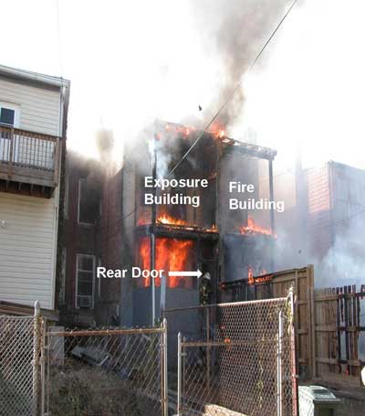arrow pointing to rear door of burning structure