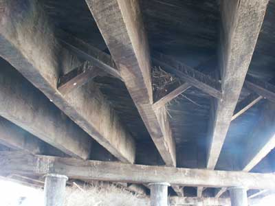 Wooden beams underneath the timber bridge