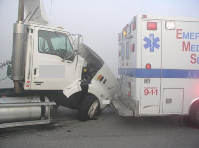 tractor trailer wrecked into ambulance