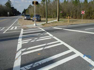 crosswalk through intersection with tire marks on the road