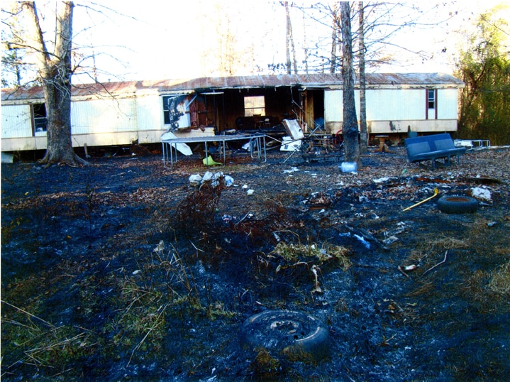 remains of mobile home after structure fire