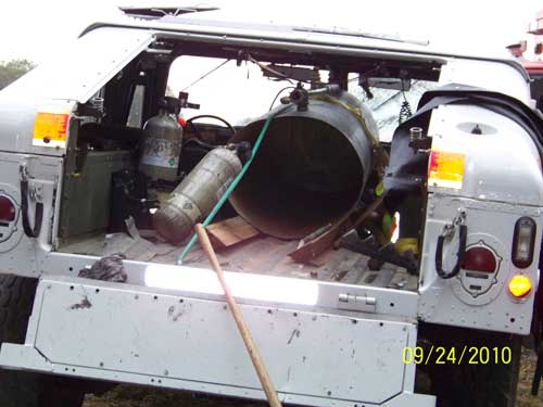 Water tank in bed of Humvee