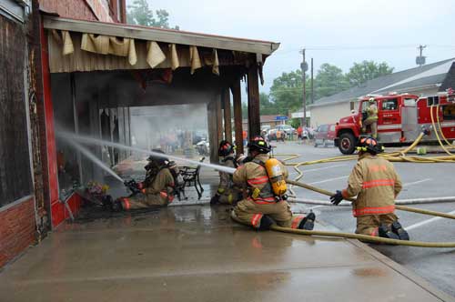 fire fighters operating hose lines