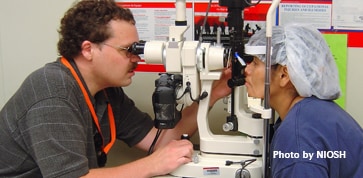 NIOSH optometrist conducting an eye exam on a poultry-processing worker