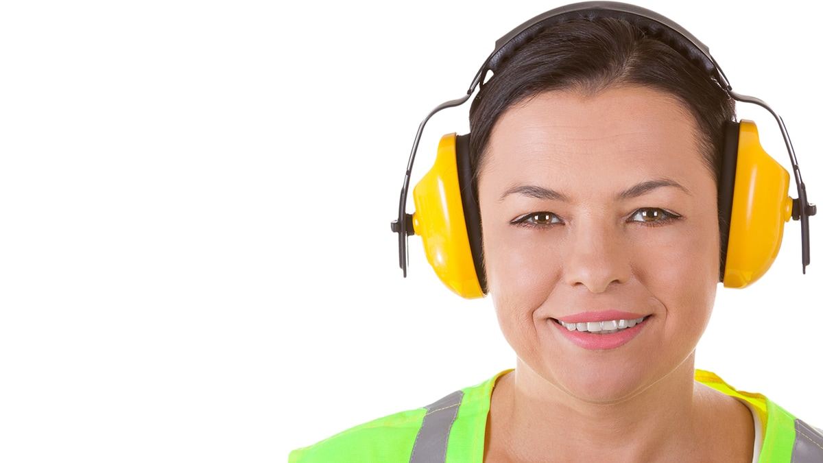 Female worker wearing hearing protection.