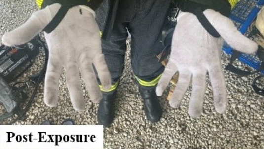 White gloves with grey/dark dirt on the palms and finger tips