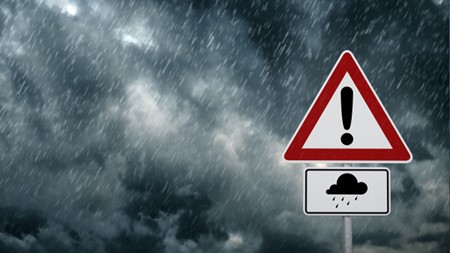 storm clouds with danger sign