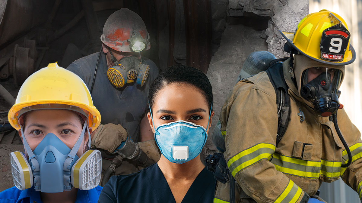 Four workers wearing respiratory protection on the job.