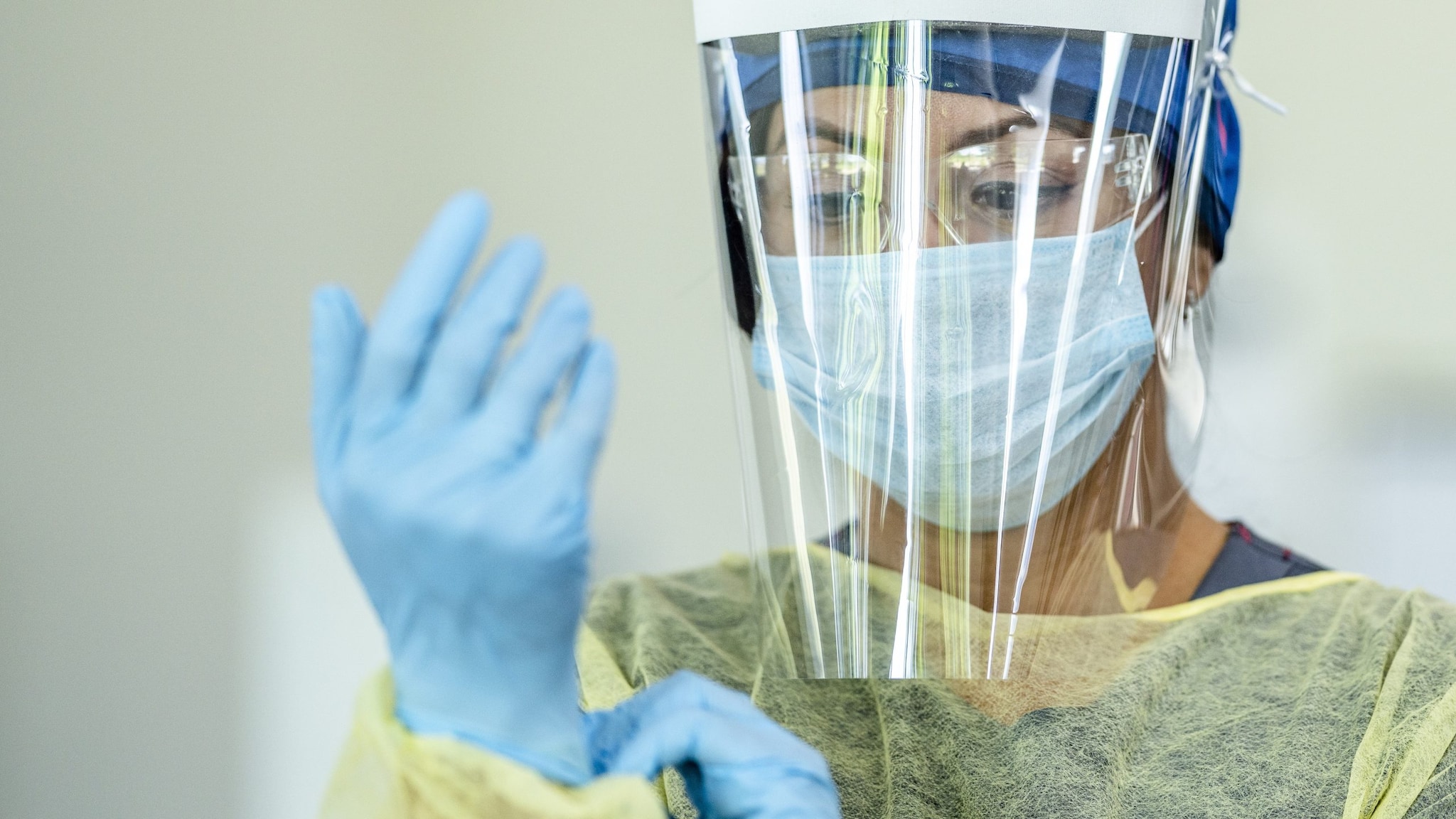 female medical assistant in personal protective equipment