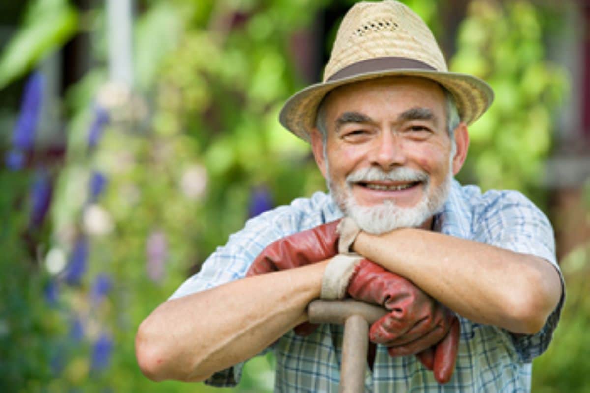 Smiling older outdoor worker