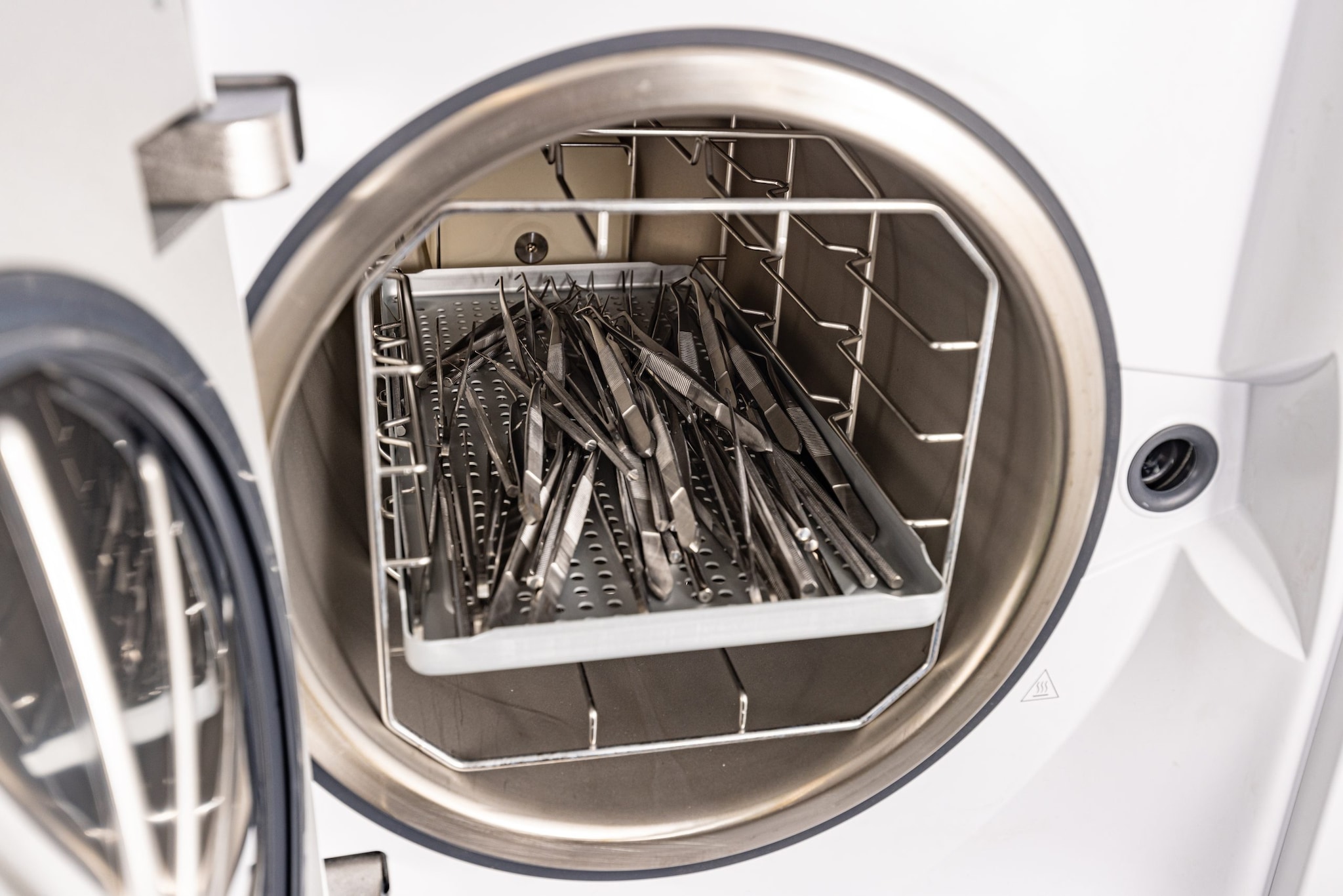 A cleaning machine sterilizes medical instruments.