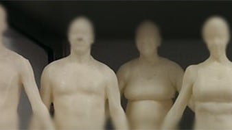 Four mannequins of various sizes stand in a row.