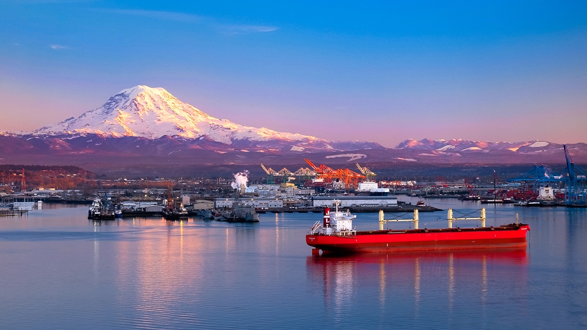 Sunset Illuminates Mt Rainier, ships and the Port of Tacoma. Tobin Akenhurst iStock/Getty Images Plus