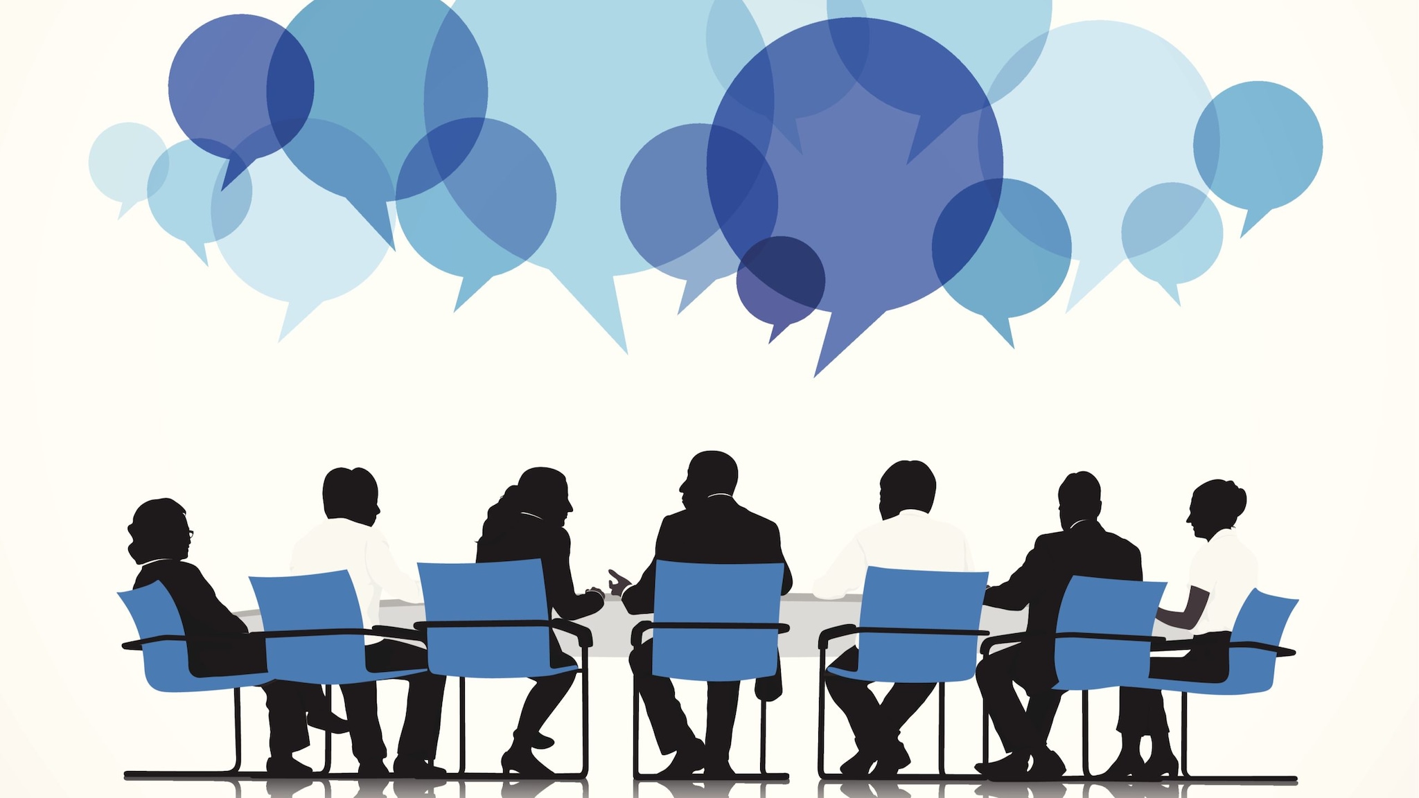 Silhouettes of people sitting at a conference table with speech bubbles above.