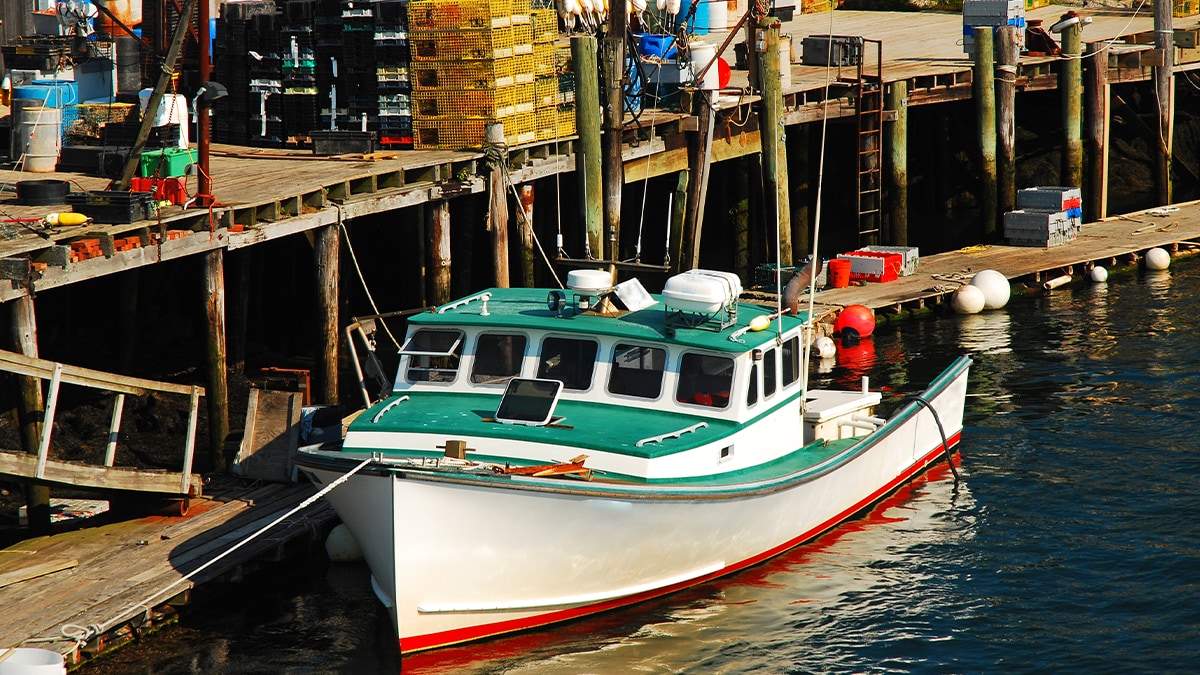 A commercial lobster boat is docked on the coast of Portsmouth, New Hampshire. Image by Getty Images