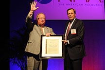 Red Conger, president of Freeport-McMoRan Americas, accepts the award from Jeff Kohler of NIOSH.