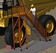 Access platform with stairs and guardrails leading up to the haul truck cab.