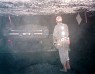 Figure 1. Miner operating a remote-controlled continuous mining machine.