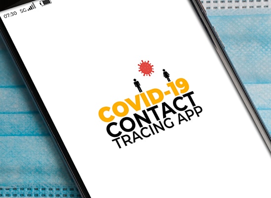 A photo of a smartphone screen with "COVID-19 Contact Tracing App" on the display