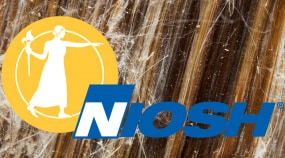 NAS and NIOSH logos on asbestos sample