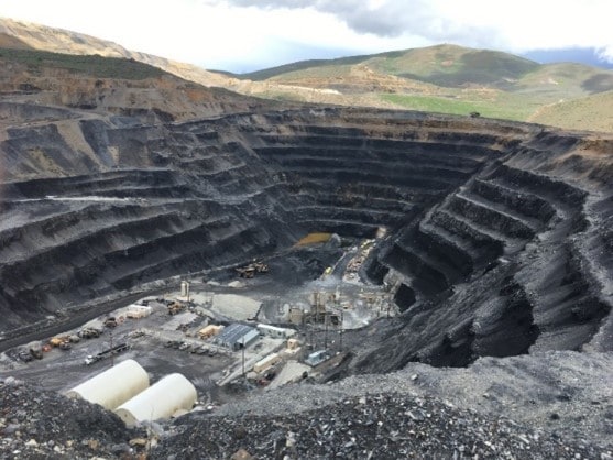 Photo showing how open pit operations will place a portal within the pit and develop underground workings to continue mining ore that the pit cannot recover. 
