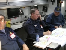 Mine management officials in a command center during a mock mine disaster.