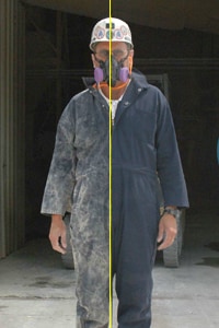 A split image of a worker shows his left side before using the clothes cleaning booth, with clothes that are covered with visible dust. The right side of the split image shows the worker after using the clothes cleaning technology, with no visible dust on his work clothes.