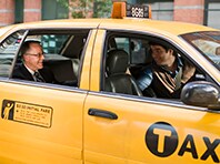 Business man talking with taxi driver