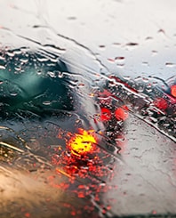 car windshield in traffic jam during rain