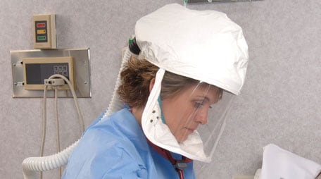 Powered air-purifying respirator being used by a healthcare worker.