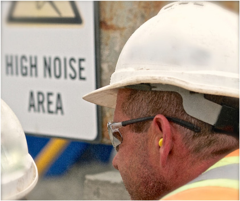 Worker with hearing protection in
