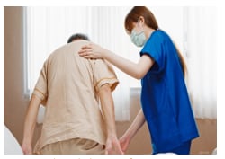 photo showing healthcare worker assisting elderly patient