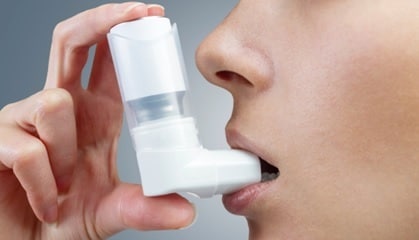 person using an enhaler