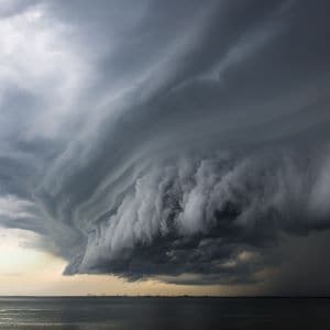 Large, dark storm cloud above water