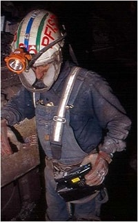 Miner using the NIOSH developed personal dust monitor.