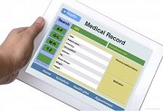 A tablet computer displays a mock template for a partial patient medical record including the patient’s work information.