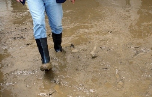 Person walking thru very muddy water
